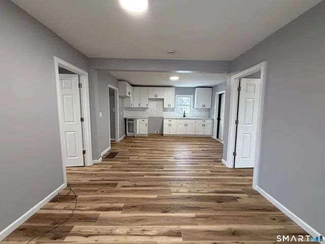 a bathroom with a sink mirror toilet and bathtub