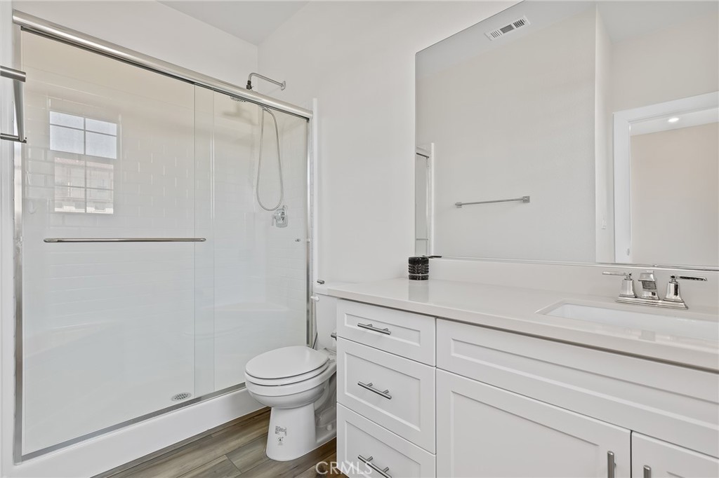 8691 Innovation Street Chino, CA 91708 - Photo 17 of 67 Full bathroom downstairs