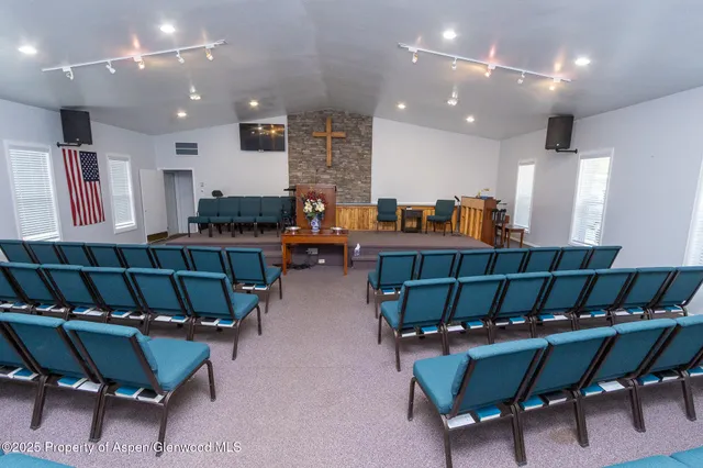 a living room with furniture and a dining room