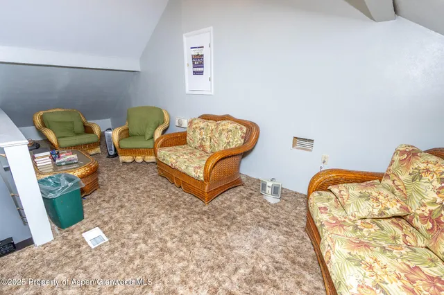 a bedroom with a bed and chandelier