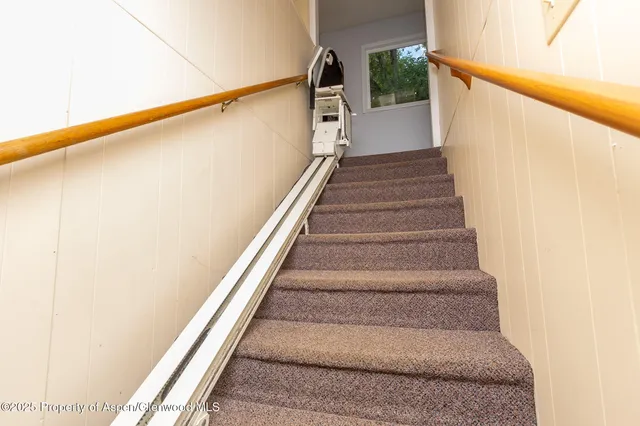 a view of kitchen with refrigerator and window