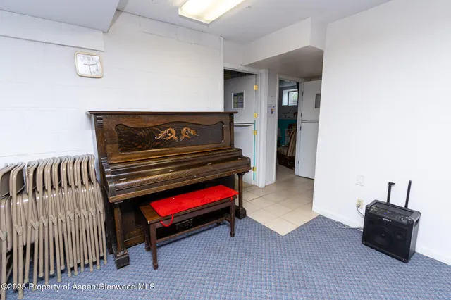 a room with pool and wooden floor