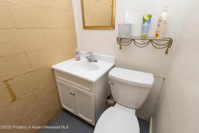 a view of a house with more windows and wooden fence