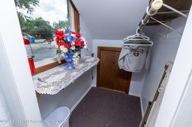 a bathroom with a granite countertop sink a mirror and vanity