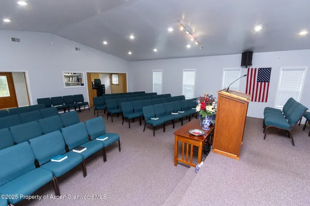 a living room with furniture a dining table and kitchen view
