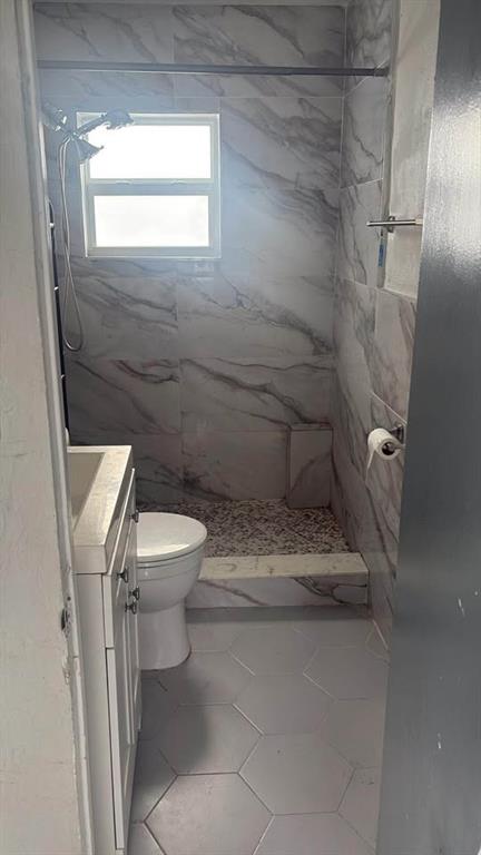 222 Northeast 13th Avenue Boynton Beach, FL 33435 - Photo 7 of 7 a bathroom with a toilet and a shower