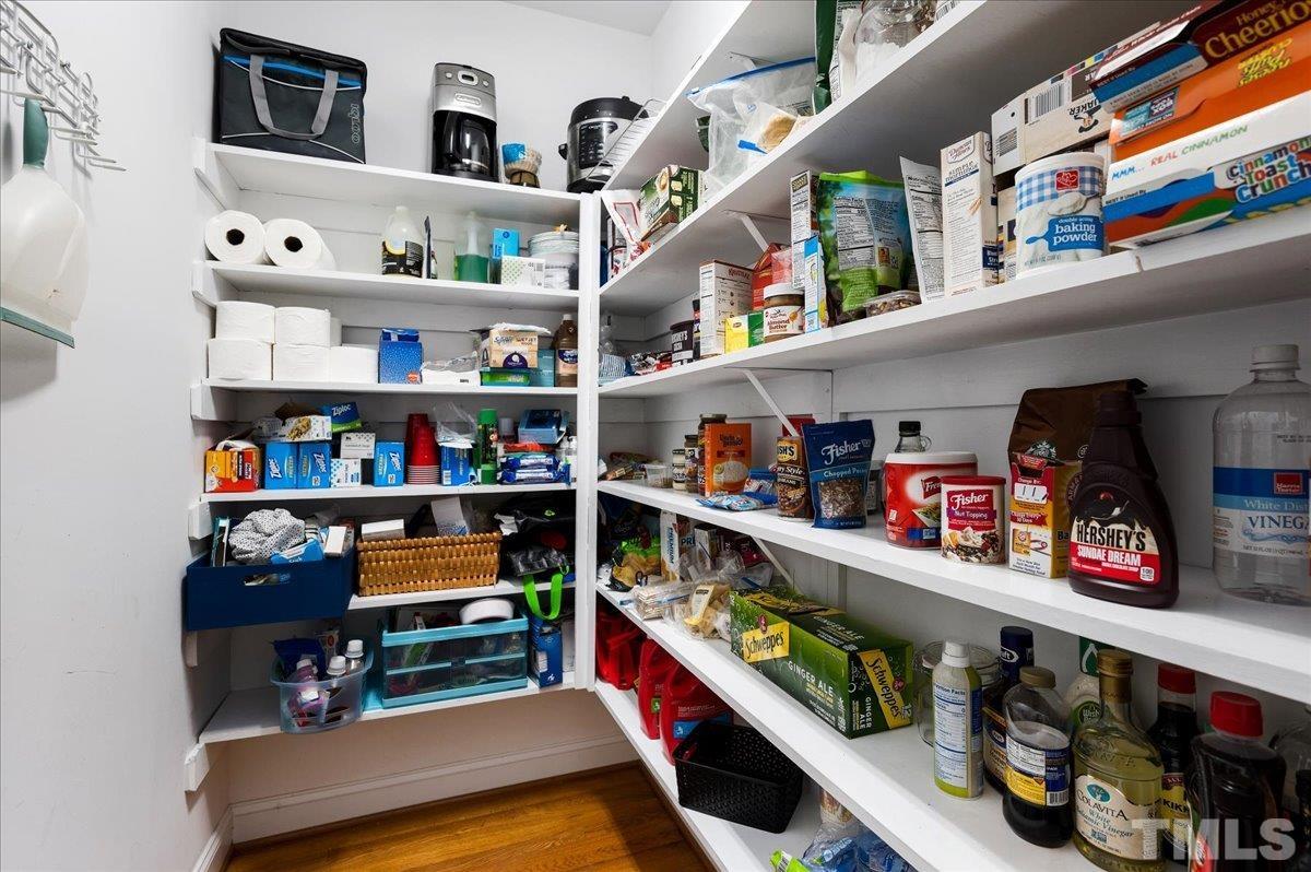 2624 Falls River Avenue Raleigh, NC 27614 - Photo 15 of 38 a room with lots of different kinds of books