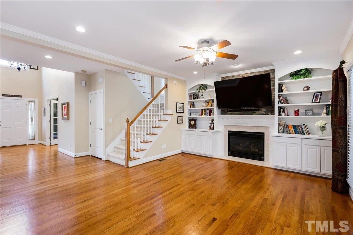 2624 Falls River Avenue Raleigh, NC 27614 - Photo 17 of 38 a view of a livingroom with an empty space and a kitchen