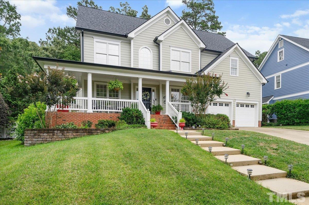 2624 Falls River Avenue Raleigh, NC 27614 - Photo 2 of 38 a view of a house with a yard and plants