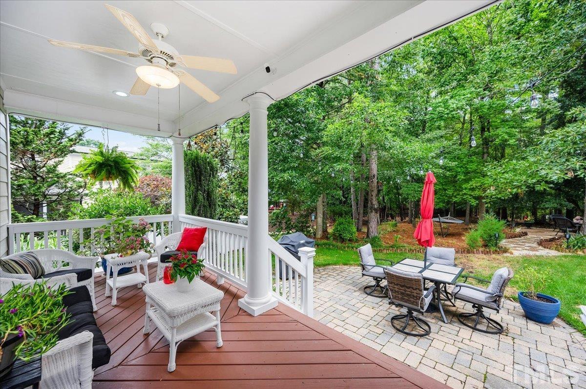 2624 Falls River Avenue Raleigh, NC 27614 - Photo 32 of 38 a living room filled with furniture and a garden