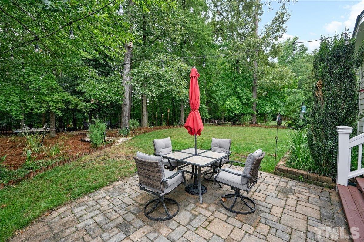 2624 Falls River Avenue Raleigh, NC 27614 - Photo 33 of 38 a view of backyard with furniture and garden