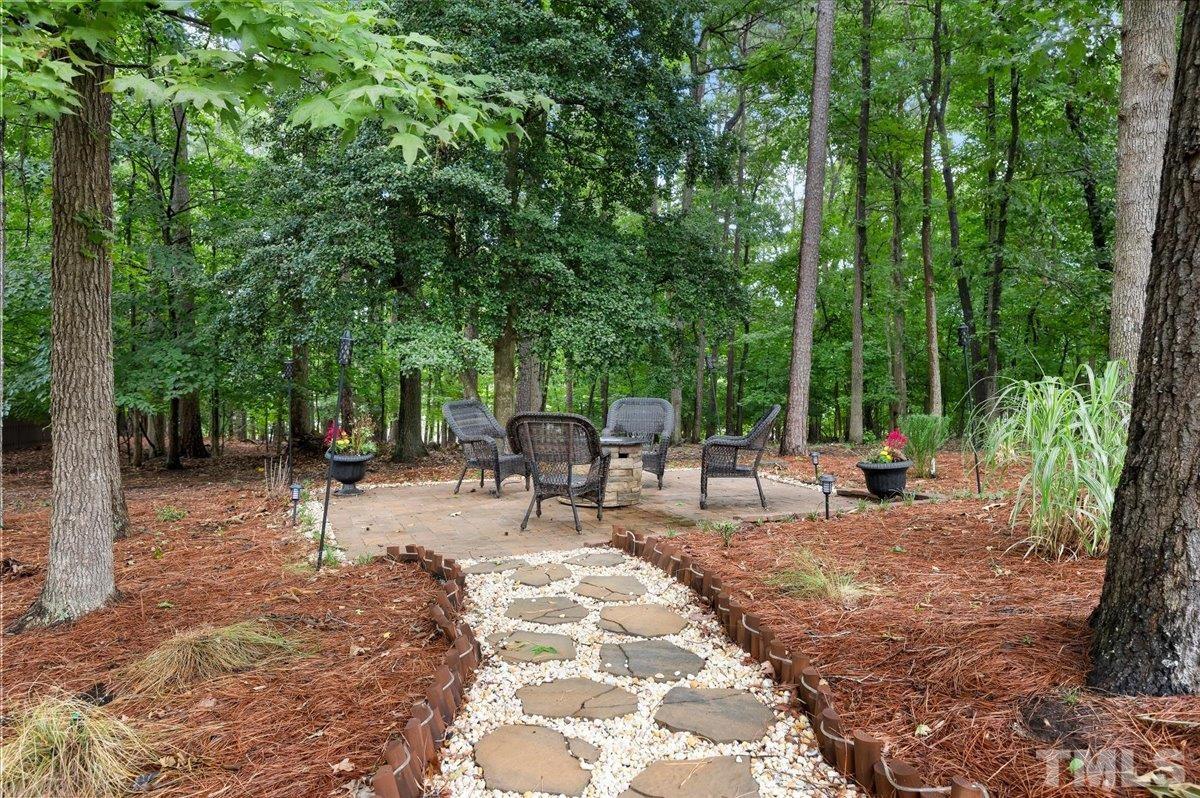 2624 Falls River Avenue Raleigh, NC 27614 - Photo 35 of 38 a view of a backyard with sitting area