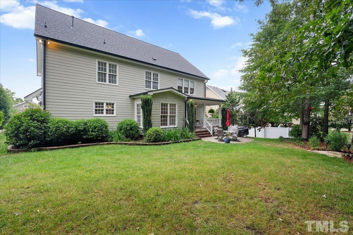 2624 Falls River Avenue Raleigh, NC 27614 - Photo 37 of 38 a front view of house with yard barbeque and outdoor seating