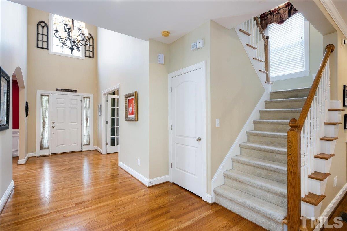 2624 Falls River Avenue Raleigh, NC 27614 - Photo 4 of 38 a view of a hallway with wooden floor and entryway