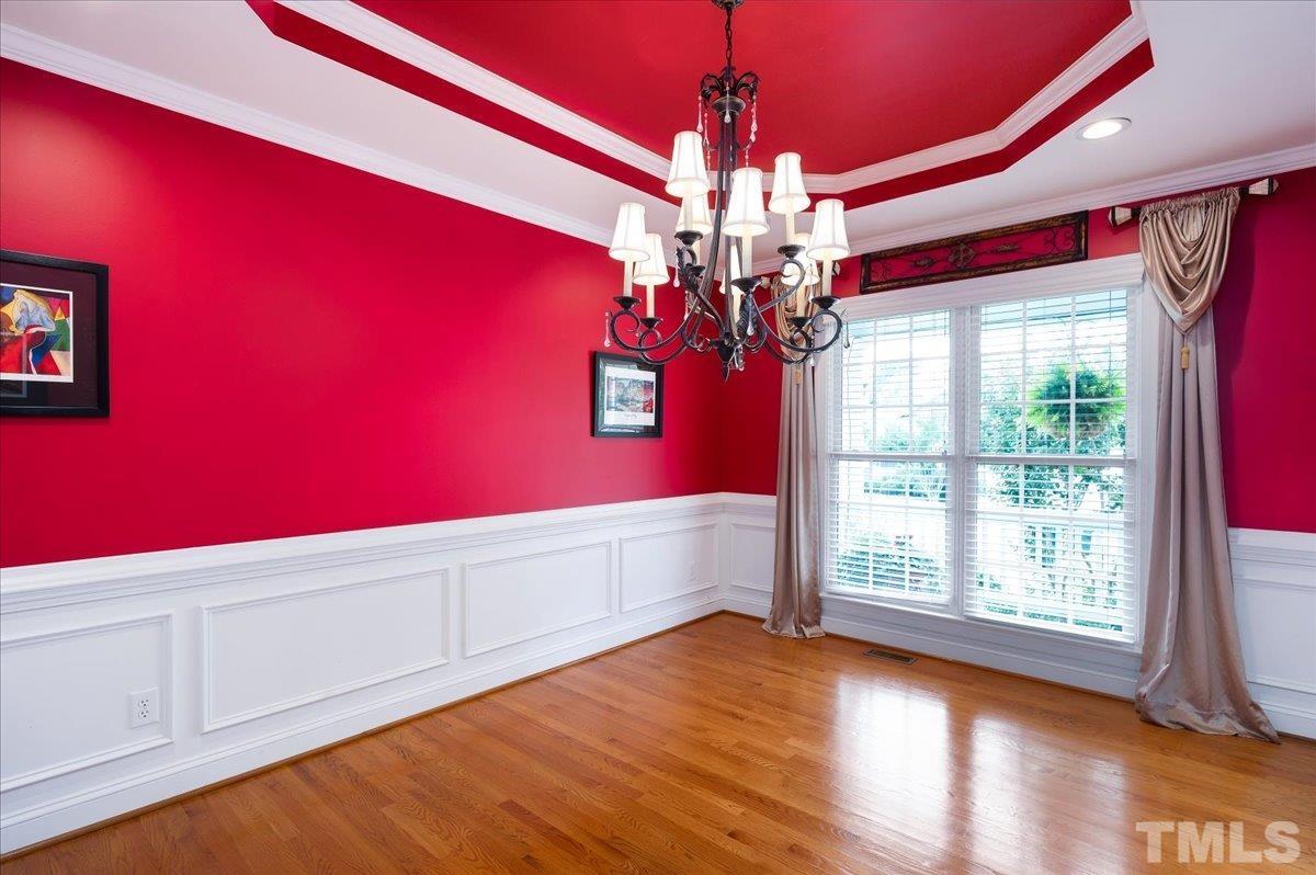 2624 Falls River Avenue Raleigh, NC 27614 - Photo 7 of 38 a view of an empty room with wooden floor and fan