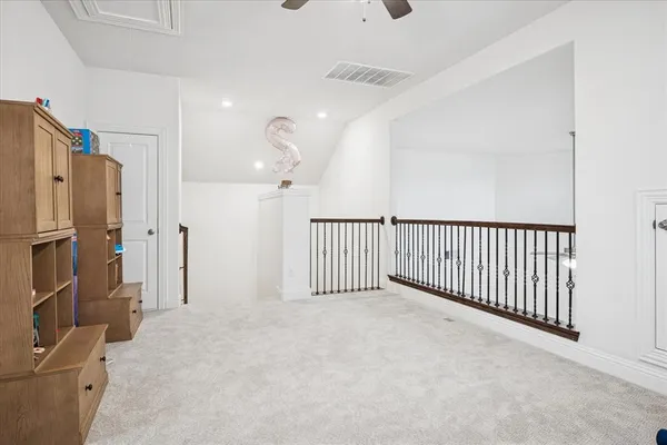 a view of a livingroom with a refrigerator