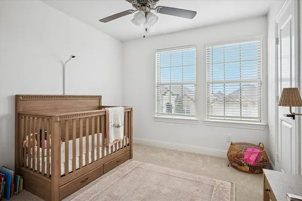 a bedroom with furniture and window