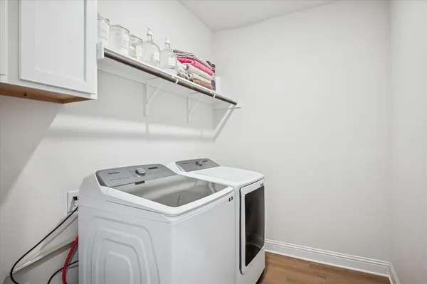 a utility room with dryer and washer