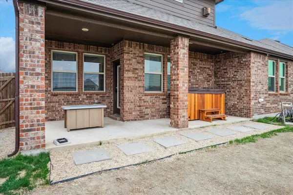 a view of a house with outdoor space and windows