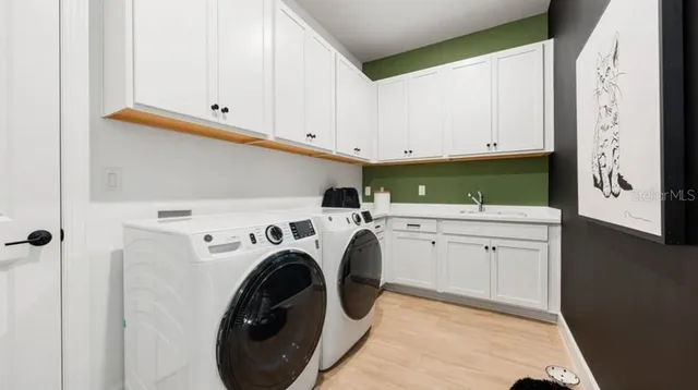 a utility room with dryer and washer