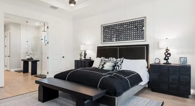 a bedroom with a bed and a table