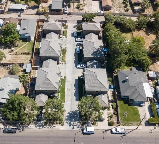 an aerial view of a house with outdoor space