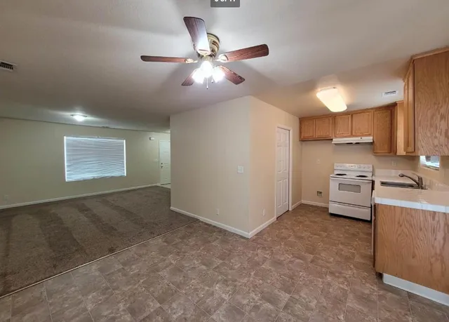 a view of a kitchen with a sink and dishwasher