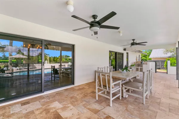 a view of a yard with a house in the background