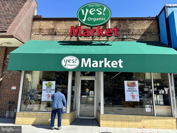a view of a shop in a street