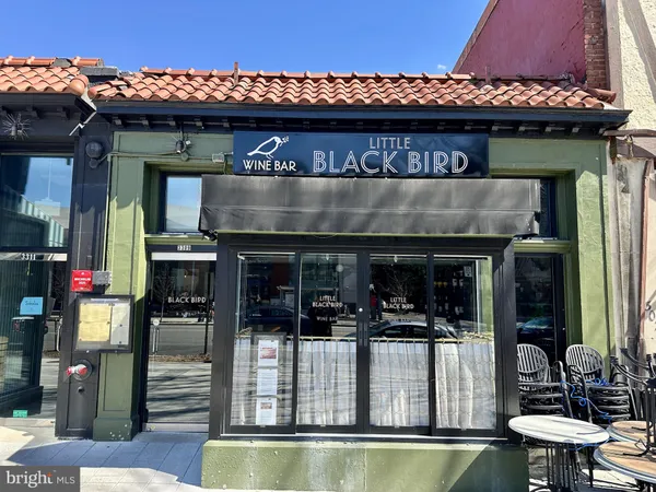a view of path along with retail shop and buildings