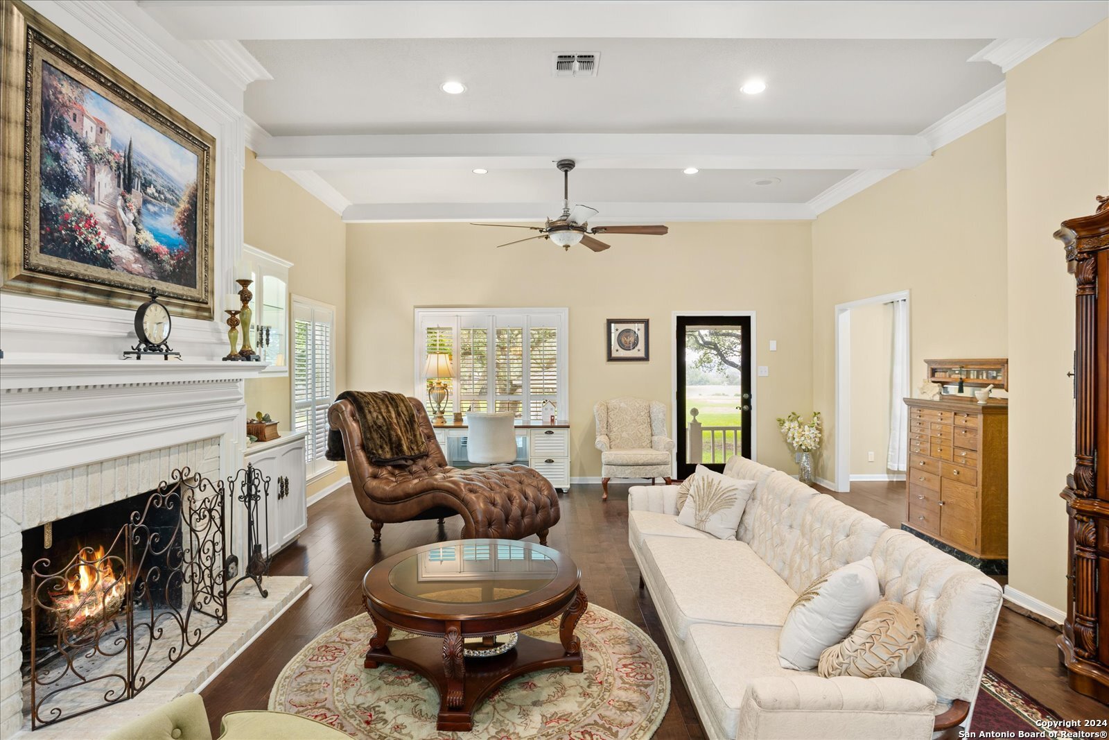 29715 Windchime Hill Fair Oaks Ranch, TX 78015 - Photo 14 of 50 a living room with furniture and a fireplace