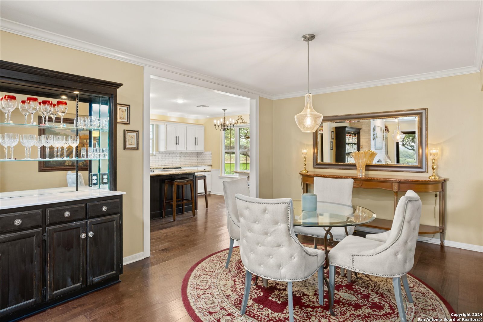 29715 Windchime Hill Fair Oaks Ranch, TX 78015 - Photo 17 of 50 a living room with furniture a dining table and a fireplace