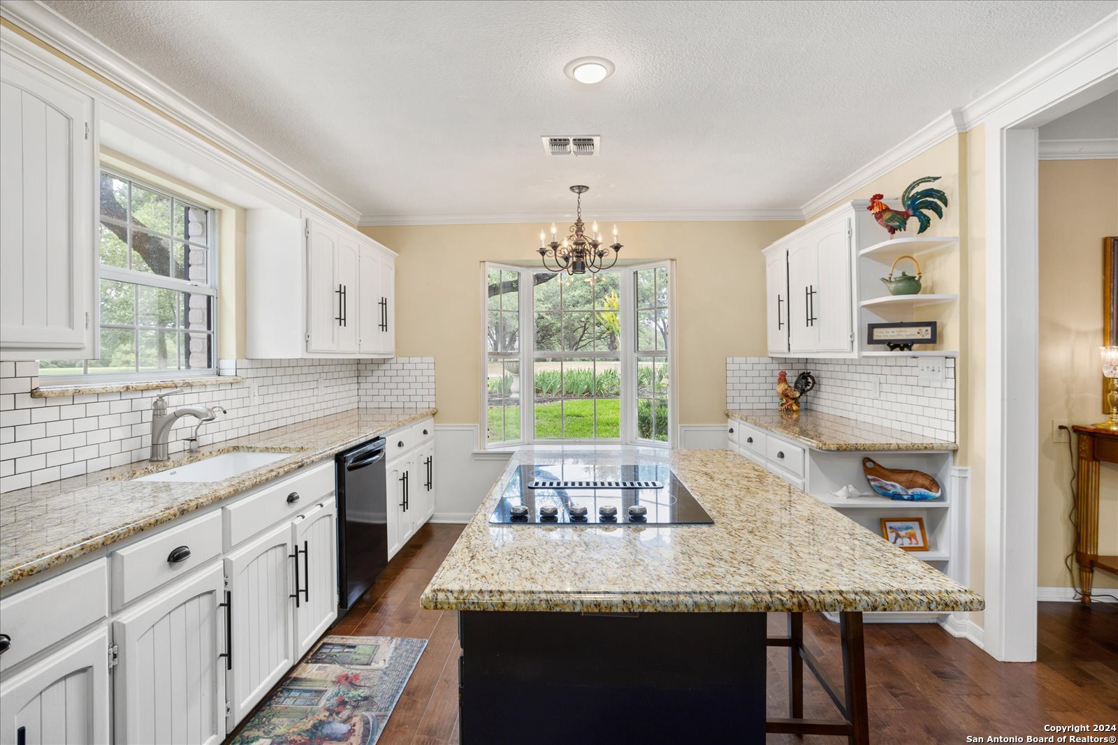 29715 Windchime Hill Fair Oaks Ranch, TX 78015 - Photo 23 of 50 a kitchen with a stove a sink dishwasher and a refrigerator with wooden floor
