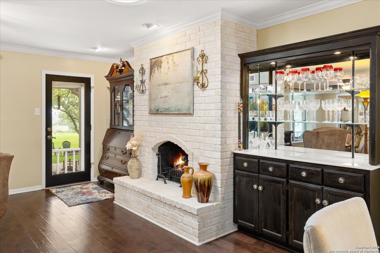 29715 Windchime Hill Fair Oaks Ranch, TX 78015 - Photo 25 of 50 a living room with furniture and a fireplace