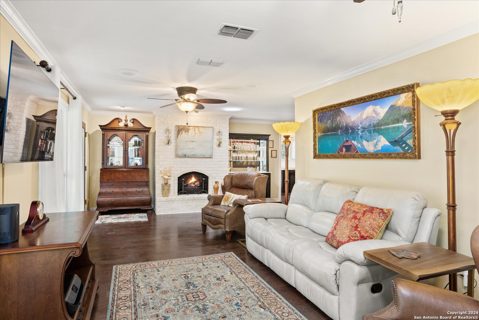 29715 Windchime Hill Fair Oaks Ranch, TX 78015 - Photo 26 of 50 a living room with fireplace furniture and a flat screen tv