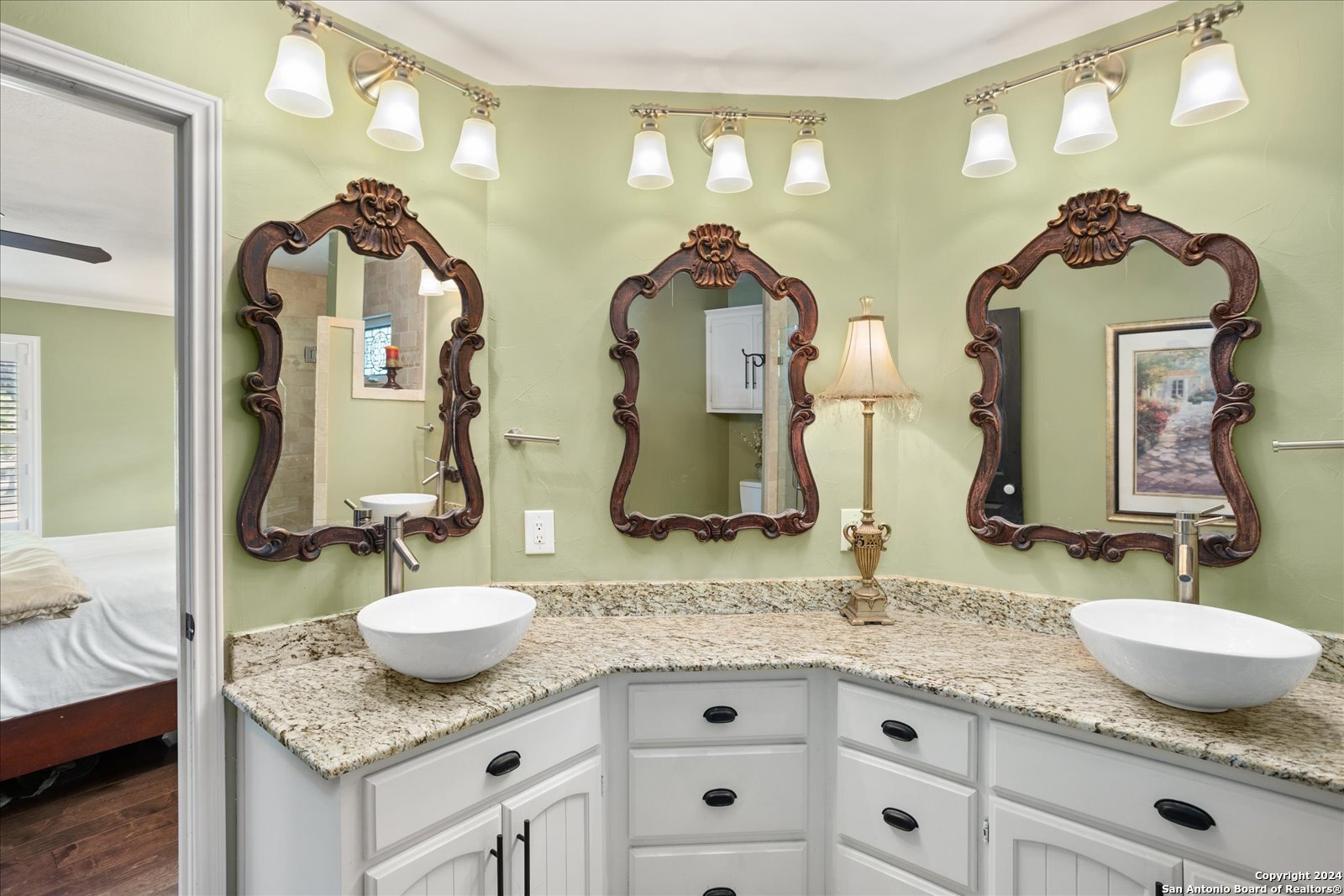 29715 Windchime Hill Fair Oaks Ranch, TX 78015 - Photo 30 of 50 a bathroom with double vanity sinks granite vanity and a mirror