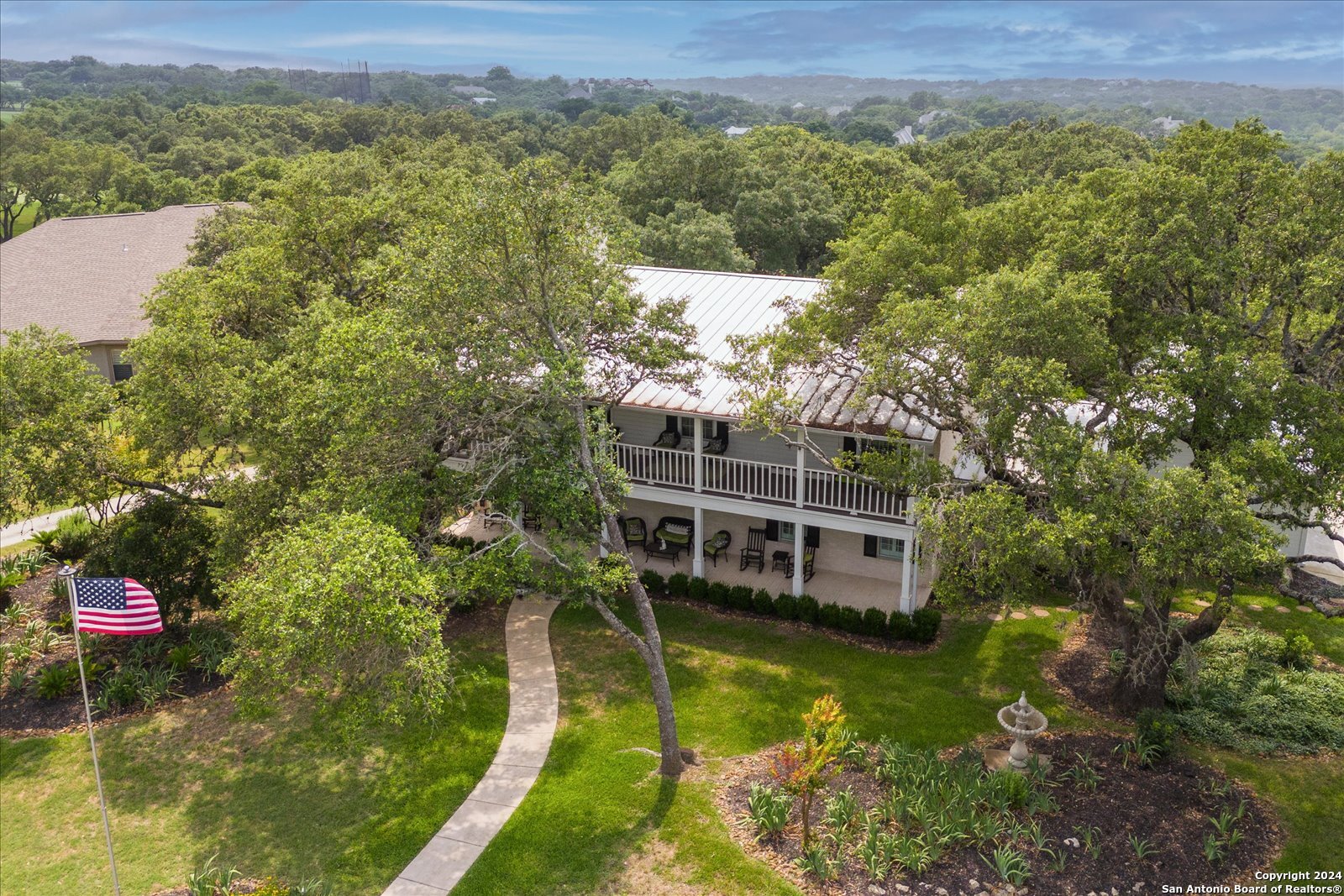 29715 Windchime Hill Fair Oaks Ranch, TX 78015 - Photo 3 of 50 a view of a house with a yard