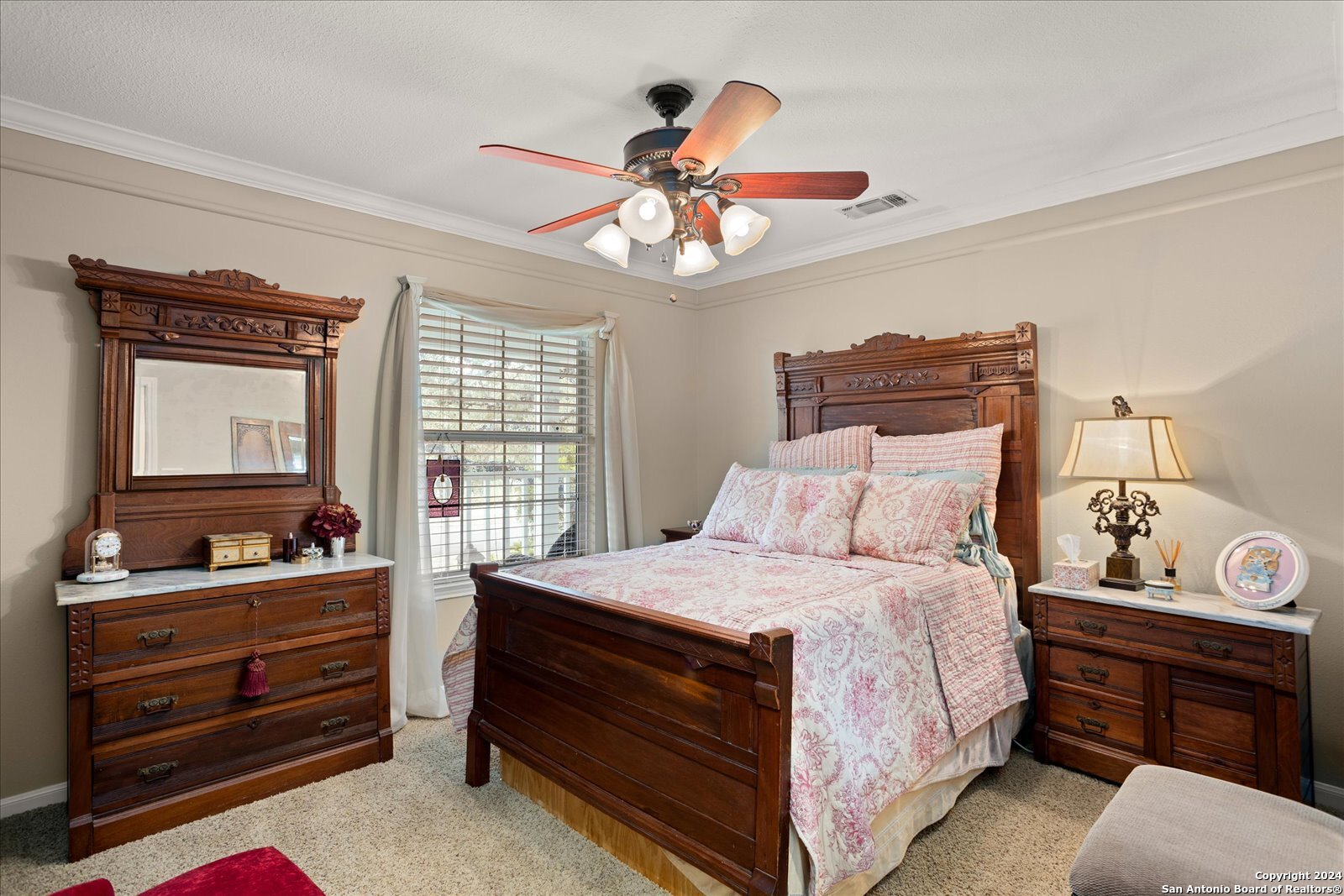 29715 Windchime Hill Fair Oaks Ranch, TX 78015 - Photo 31 of 50 a bedroom with a bed and dresser