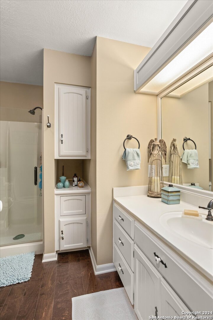 29715 Windchime Hill Fair Oaks Ranch, TX 78015 - Photo 32 of 50 a kitchen with sink and cabinets