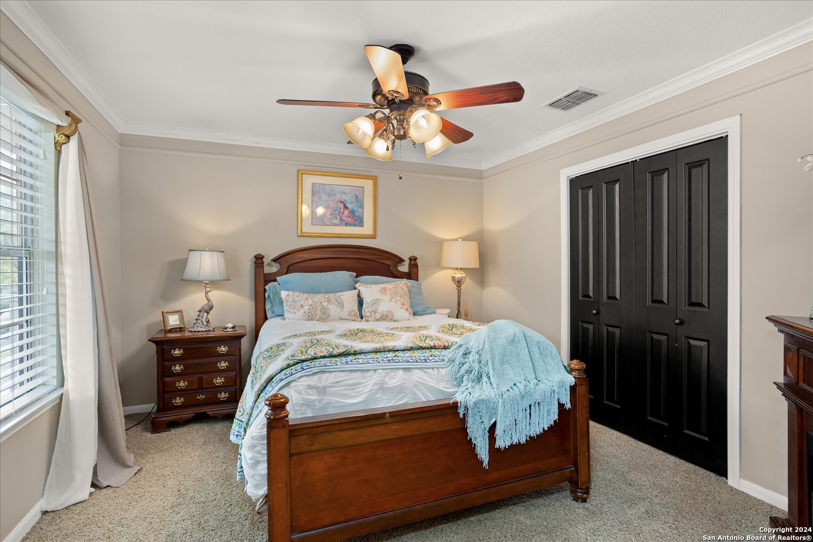 29715 Windchime Hill Fair Oaks Ranch, TX 78015 - Photo 33 of 50 a bedroom with a bed and a chandelier