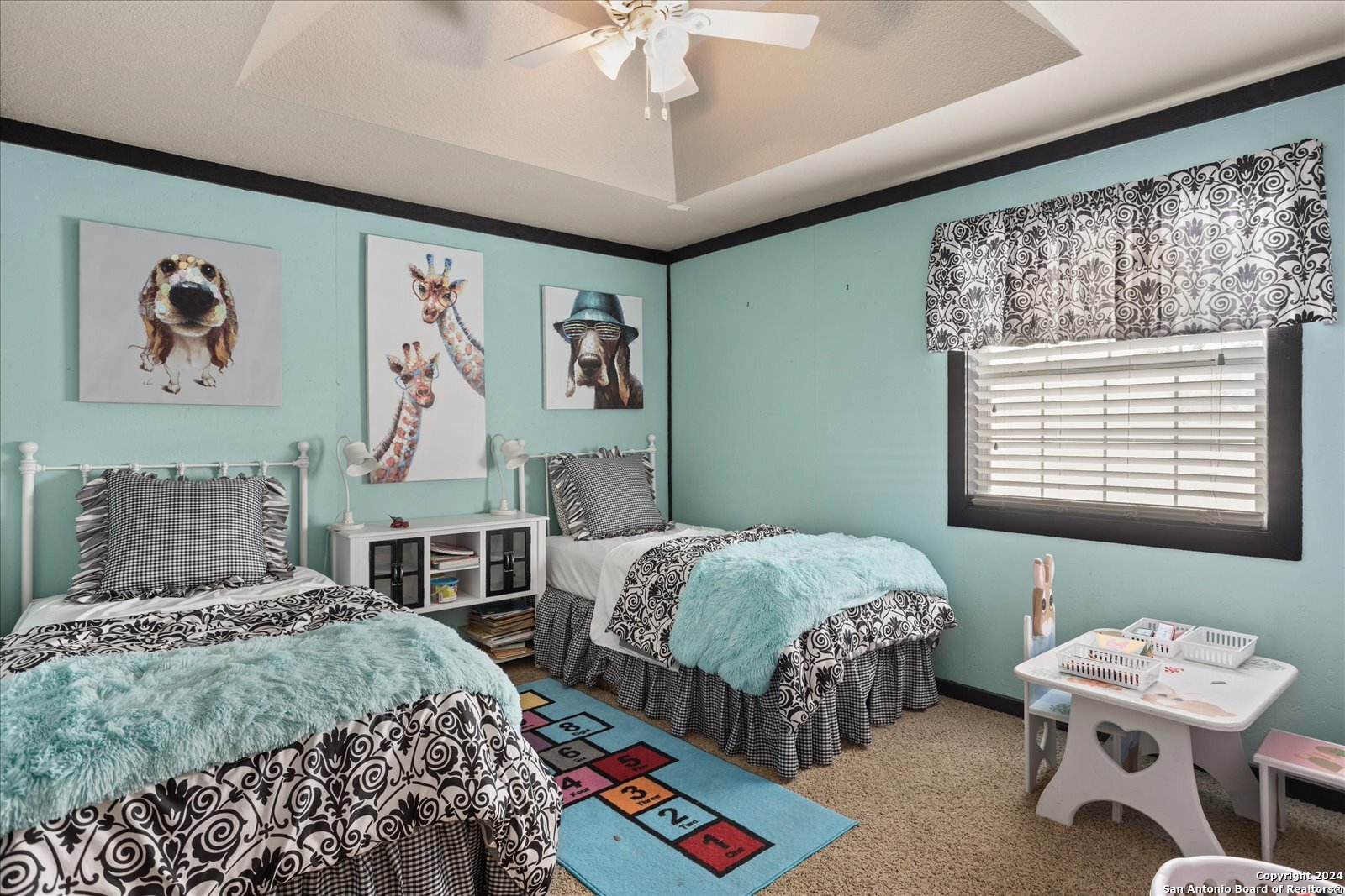 29715 Windchime Hill Fair Oaks Ranch, TX 78015 - Photo 37 of 50 a bedroom with two beds and a table