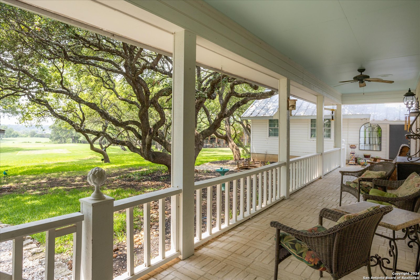 29715 Windchime Hill Fair Oaks Ranch, TX 78015 - Photo 39 of 50 a view of a porch with furniture and backyard