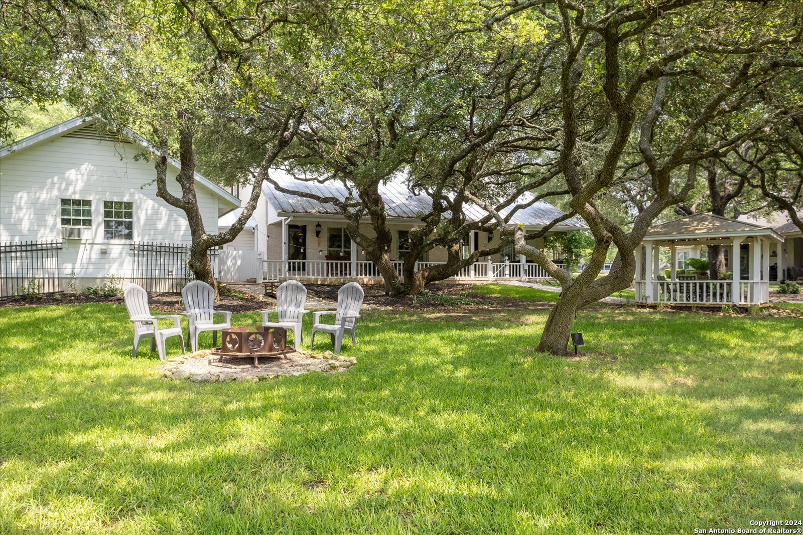 29715 Windchime Hill Fair Oaks Ranch, TX 78015 - Photo 43 of 50 a view of a house with a yard porch and sitting area