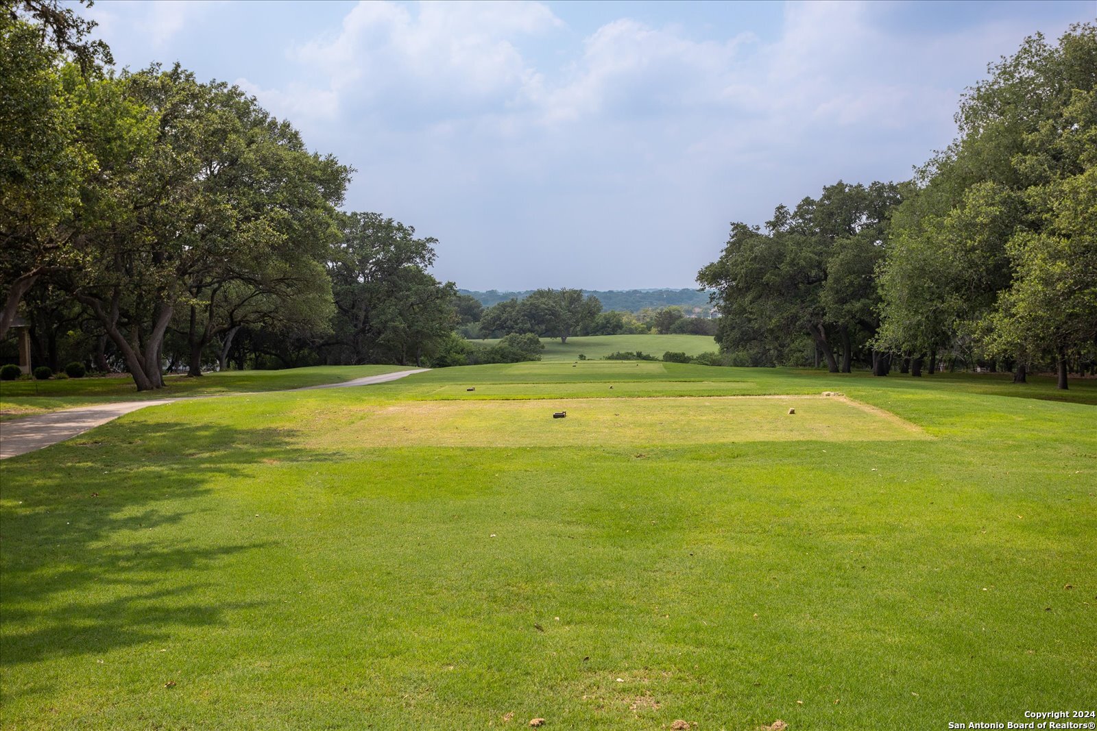 29715 Windchime Hill Fair Oaks Ranch, TX 78015 - Photo 45 of 50 a view of a swimming pool with an outdoor space and seating area
