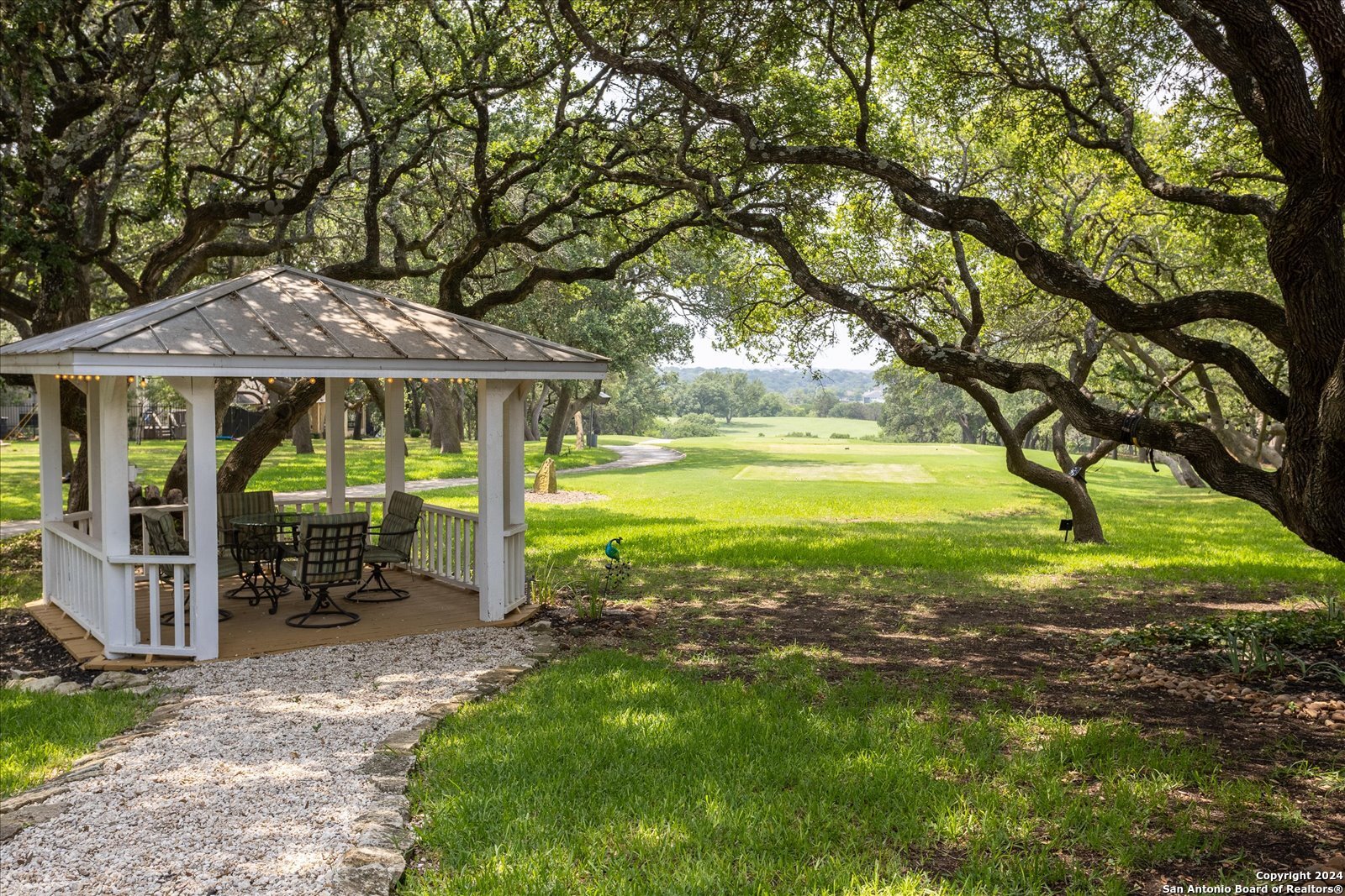 29715 Windchime Hill Fair Oaks Ranch, TX 78015 - Photo 6 of 50 a view of a house with a yard