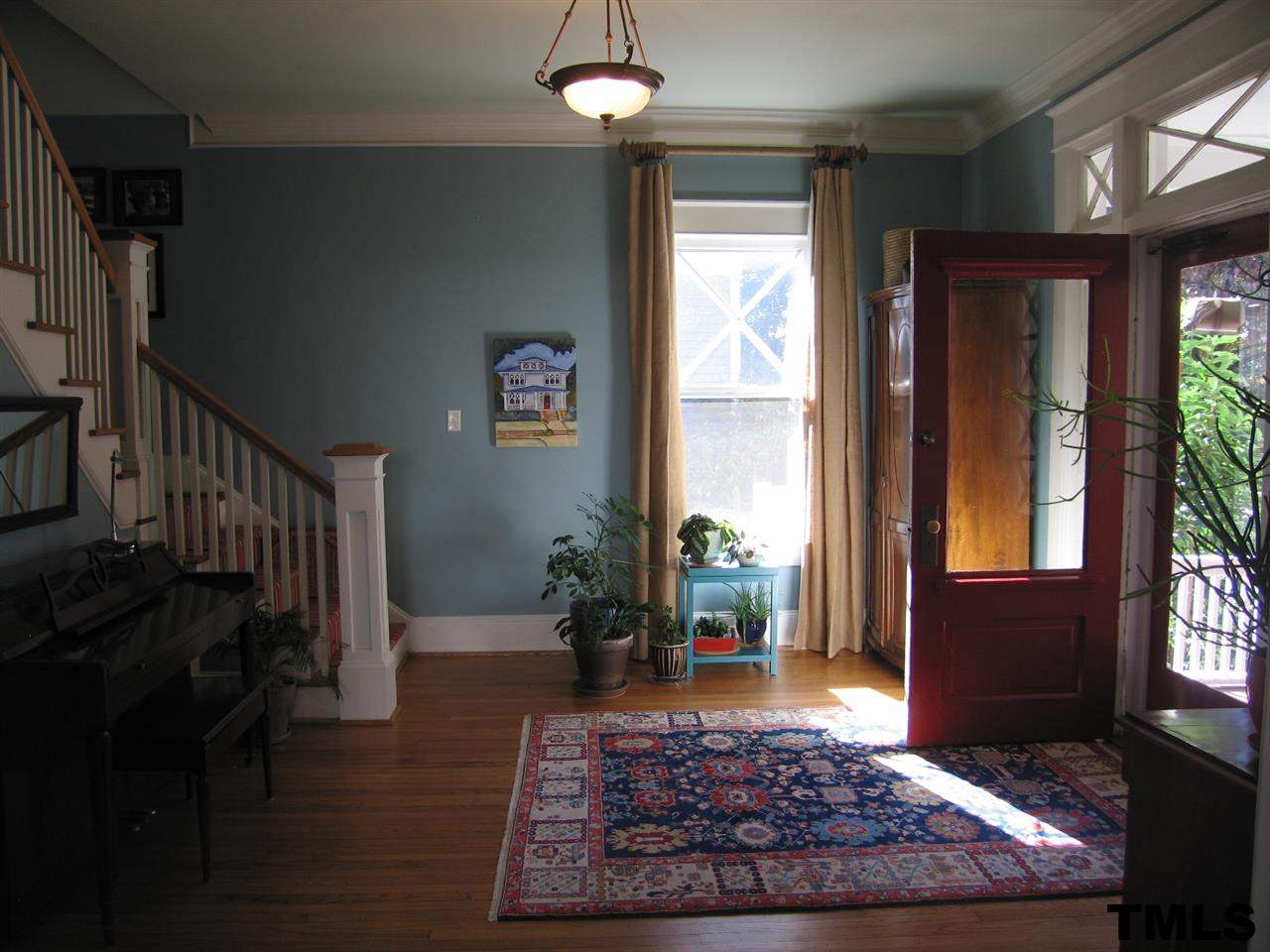 120 Hillcrest Road Raleigh, NC 27605 - Photo 3 of 25 a living room with furniture rug and a table