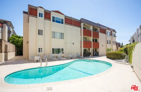 a view of pool with outdoor seating
