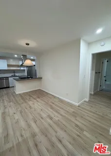 a room with a bed and furniture