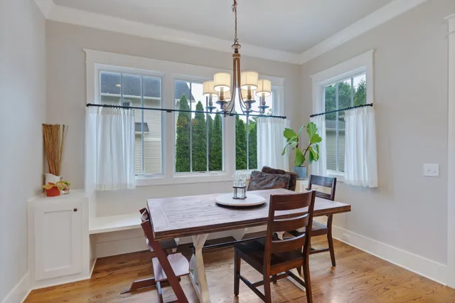 a dining room with furniture window wooden floor