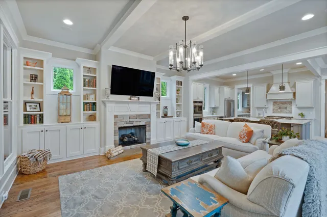 a living room with furniture fireplace and flat screen tv